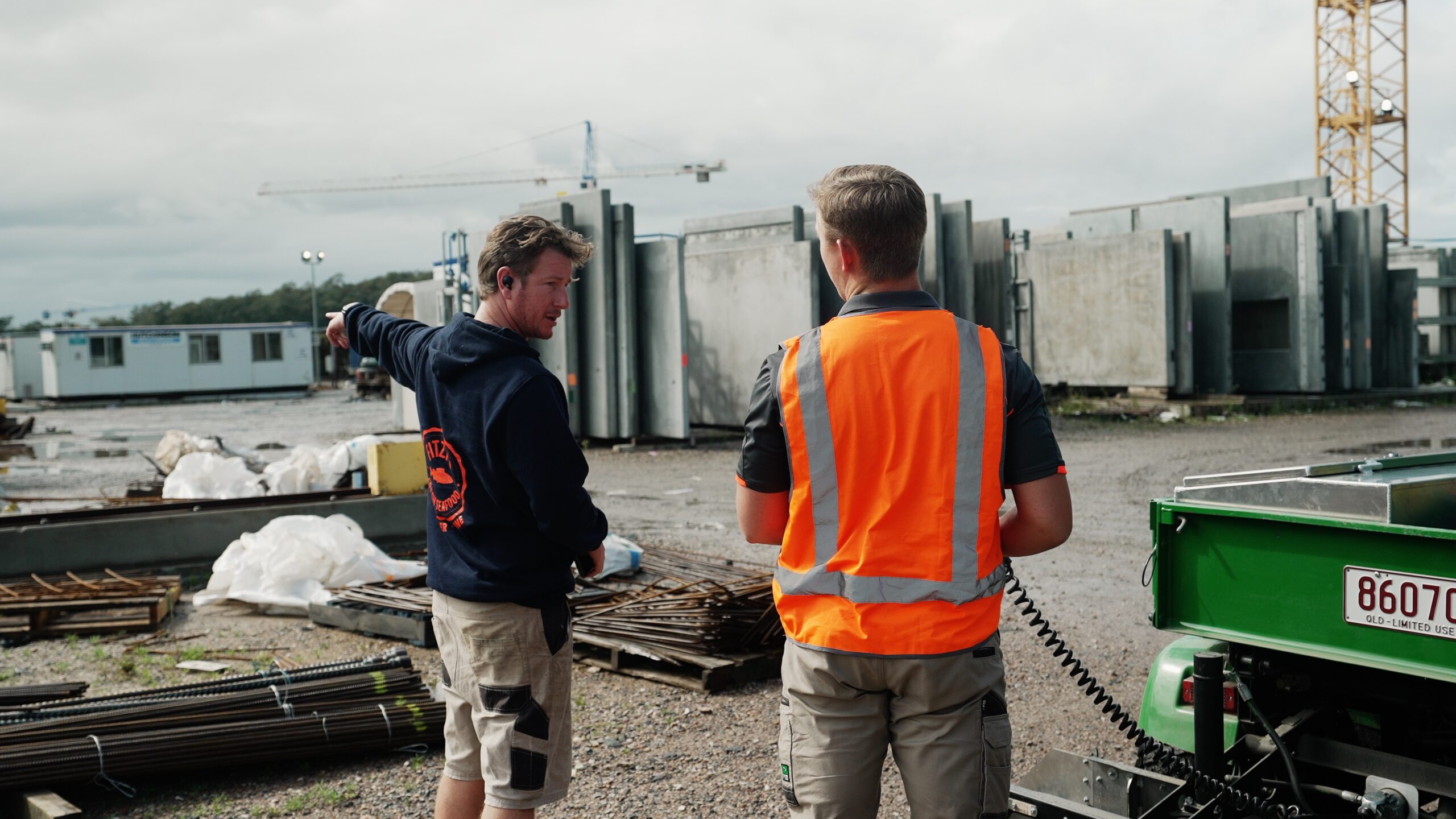 Magneteh Technician and a guy pointing at left side